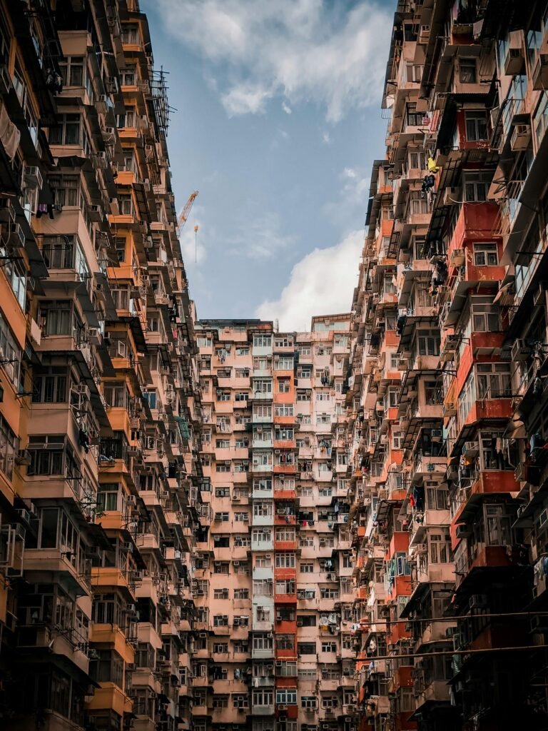 High-rise residential building facade in Hong Kong showcasing dense urban living.